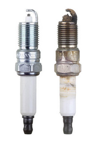 Old and new spark plug